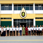 **Image Prompt:** A diverse group of people standing in front of the Brunei Immigration Department building, some holding passports and documents. The scene should convey a sense of hope and anticipation, while also subtly hinting at the bureaucratic process. The building is modern and clean, with the Brunei flag prominently displayed. The overall tone is professional and slightly aspirational. Consider including traditional Brunei architectural elements in the building design.